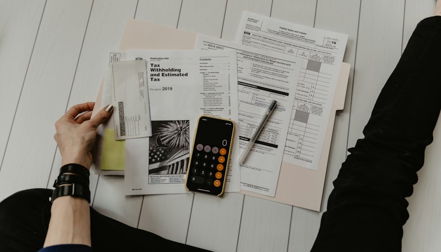 Invoices and a calculator on a desk