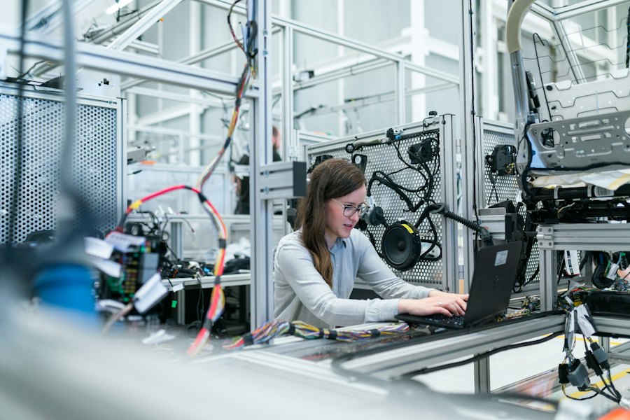 Engineer next to a production line